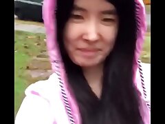 Chinese Teen publicly unsheathes herself in the rain!