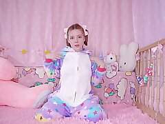 COZY ANAL: a baby in pajamas plays with